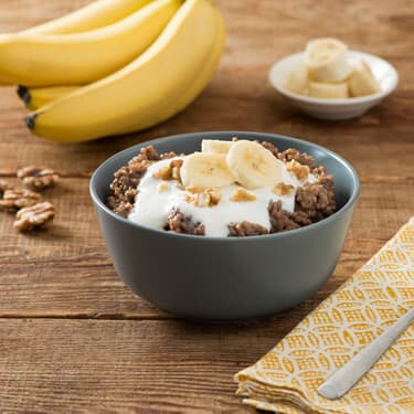 A bowl of overnight chocolate oats topped with banana