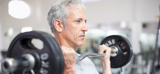 Healthy diet in your 50 A man lifting weights